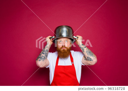 worried chef with beard and red apron plays with pot worried chef with beard and red apron plays with pot 96318728