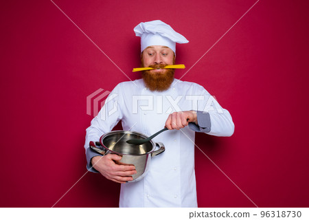 Happy chef with beard and red apron is ready to cook 96318730