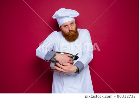 chef with beard and red apron is jealous of his recipe chef with beard and red apron is jealous of his recipe 96318732