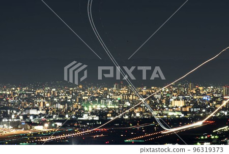 Night view of Osaka Airport Airplanes taking off and landing Intersecting light trails Night view of Osaka Airport Airplanes taking off and landing Intersecting light trails 96319373