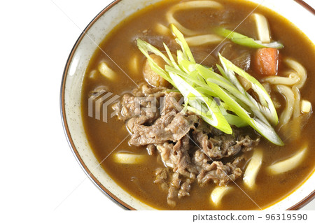 A bird's-eye view of curry udon with green onions and beef on a white background A bird's-eye view of curry udon with green onions and beef on a white background 96319590