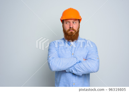 Isolated doubter architect with beard and orange helmet 96319805