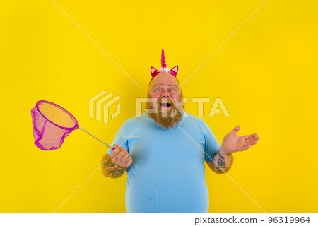 Fat thoughtful man with headband play with sea net 96319964