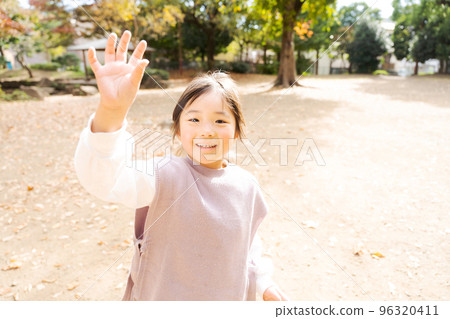 Girls playing in the park Girls playing in the park 96320411
