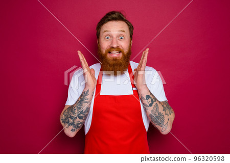 happy isolated chef with beard and red apron 96320598