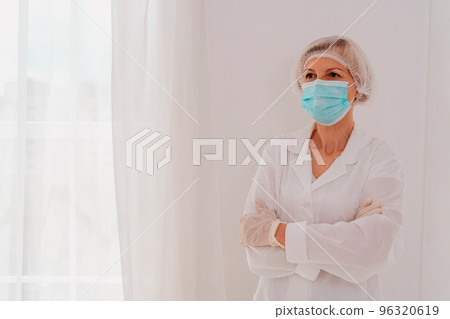 Doctor with face mask and gloves against covid-19 virus Doctor with face mask and gloves against covid-19 virus 96320619