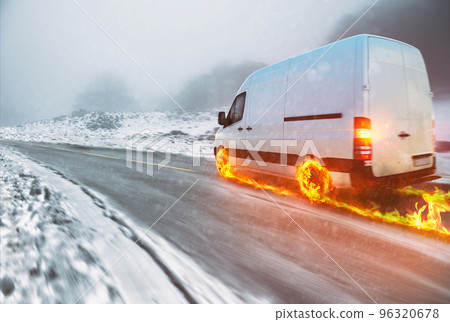 White van with fiery wheels on a snow covered road White van with fiery wheels on a snow covered road 96320678