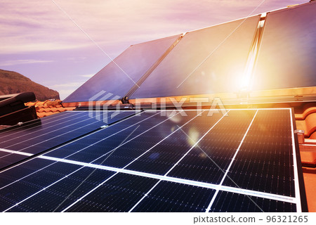 Renewable energy system with solar panel for electricity and hot water 96321265