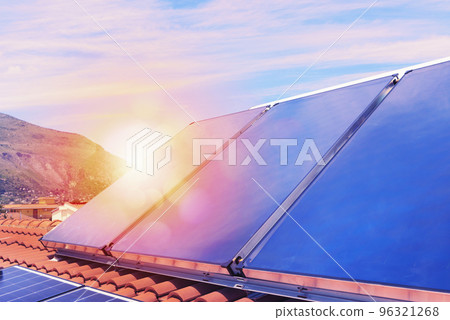 Renewable energy system with solar panel for electricity and hot water 96321268
