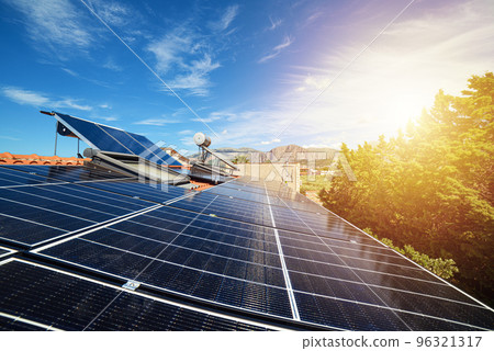 Renewable energy system with solar panel for electricity and hot water 96321317