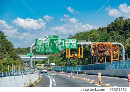 Passenger car approaching the Toki junction under construction on the Chuo Expressway, Gifu Prefecture Passenger car approaching the Toki junction under construction on the Chuo Expressway, Gifu Prefecture 96321582