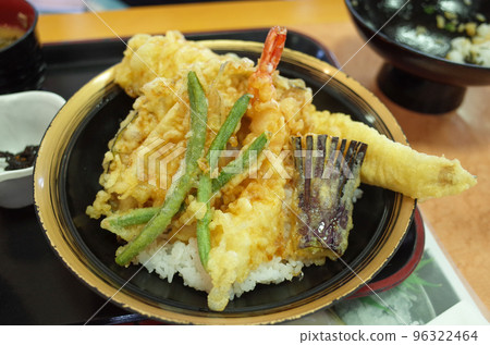 Bowl of rice and fried fish 96322464