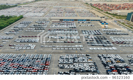 Aerial view of new cars stock at factory parking lot. Above view many cars parked in a row. Automotive industry. Logistics and supply chain business. Import or export new cars at warehouse near port. 96323160