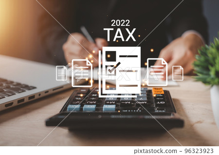 Tax 2022 of Individual income paid and corporations concept. Businessman using a calculator and laptop (notebook) of Data analysis, Paperwork, financial research, and report. Tax 2022 of Individual income paid and corporations concept. Businessman using a calculator and laptop (notebook) of Data analysis, Paperwork, financial research, and report. 96323923