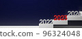 Illustration of three-dimensional numbers representing the year 2023 lined up on the stairs 96324048