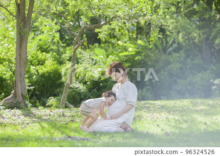 A pregnant mom and her 2-year-old daughter A pregnant mom and her 2-year-old daughter 96324526