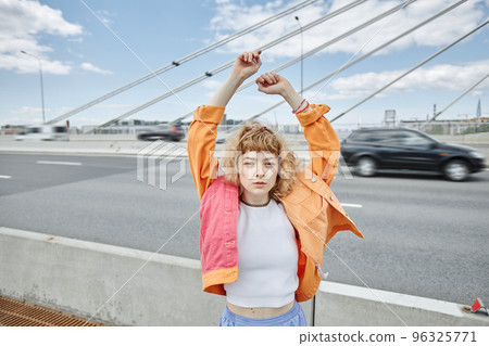 Carefree young woman wearing colorful clothes 96325771