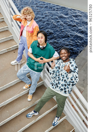 Diverse young people on stairs looking up 96325780