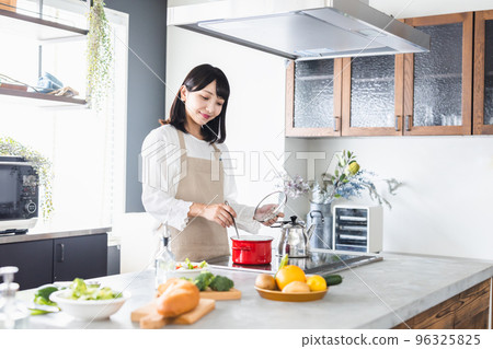 Women's kitchen cooking lifestyle 96325825