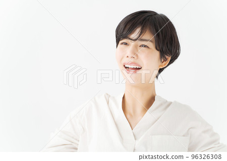 Smiling portrait of a woman in her 20s Smiling portrait of a woman in her 20s 96326308