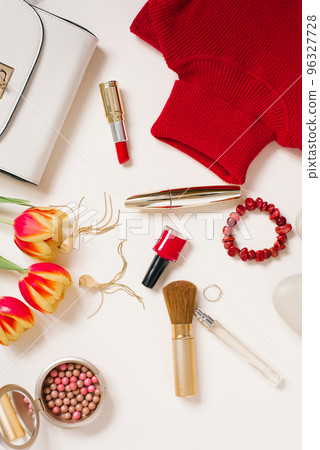 Clothing and cosmetics blogger for Valentine's Day and a bouquet of tulips. Top view 96327728