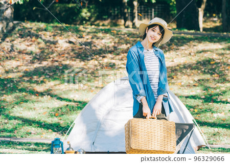 Woman doing outdoor fashion at camp 96329066