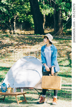 Woman doing outdoor fashion at camp Woman doing outdoor fashion at camp 96329070