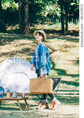 Woman doing outdoor fashion at camp 96329072