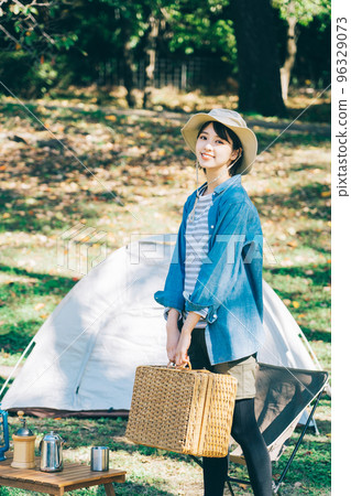 Woman doing outdoor fashion at camp 96329073