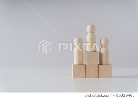 wooden figures peg doll standing on the podium of wooden cube blocks with copy space. ranking and strategy concept. 96329403