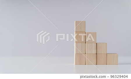 Pile of wooden cube block stack as stair step on the table. Success, climbing to the top, Progression, business growth concept. 96329404