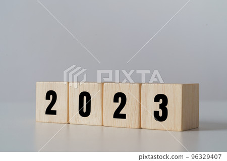 start to year 2022. wooden cube block with 2023 year text. happy new years concept. start to year 2022. wooden cube block with 2023 year text. happy new years concept. 96329407