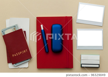 Iqos electronic blue cigarette on a beige background. 96329849