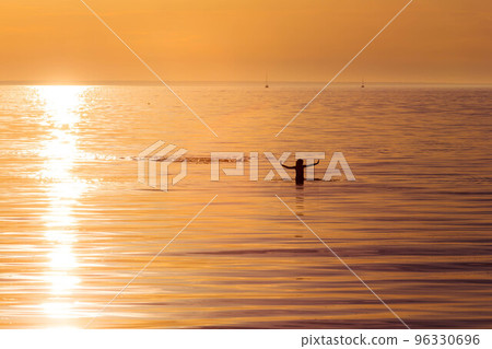 ocean woman in sunset light ocean woman in sunset light 96330696