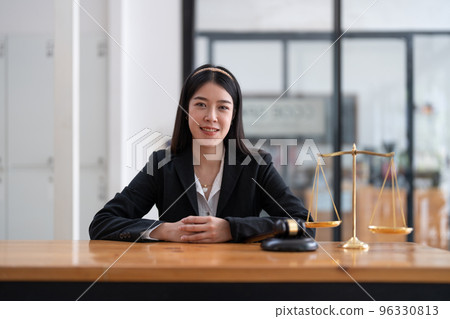 Portrait confidence asian lawyer looking on camera sitting at work desk in office. 96330813