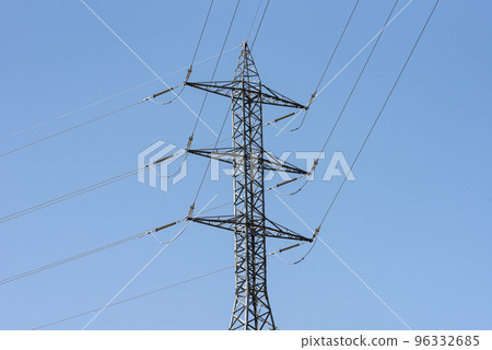 High voltage electricity pole on blue sky background High voltage electricity pole on blue sky background 96332685