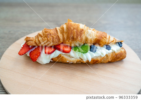 croissant filled with cream and fruit 96333359