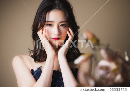 A woman in a navy dress A woman in a navy dress 96333733