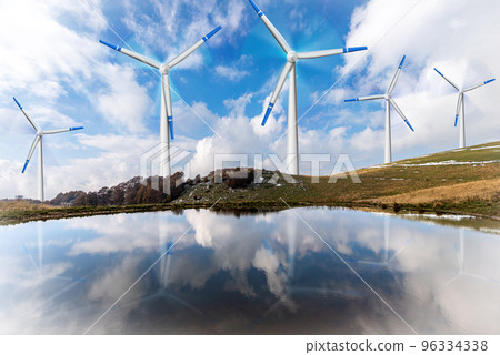 Group of Wind Turbines on a Mountain Landscape with a Beautiful Lake Group of Wind Turbines on a Mountain Landscape with a Beautiful Lake 96334338