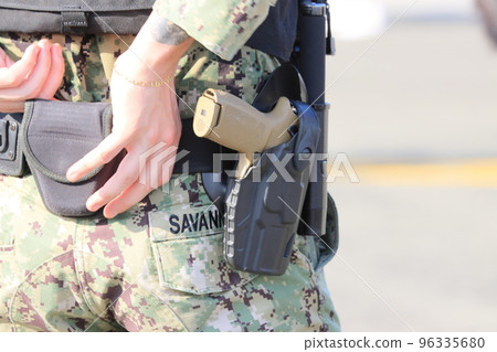 US soldier with a pistol on his waist MP military police 96335680