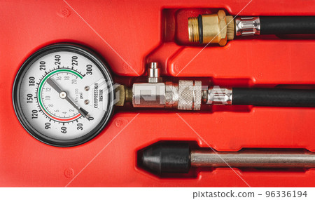 Monometer close-up. Engine compression tester isolated on white background. Set for testing the internal combustion engine.  96336194