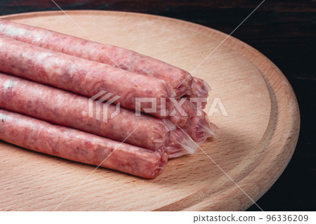 Sausages in natural casing. Raw BBQ sausages. Thin sausages. Homemade sausages. Sausages in natural casing. Raw BBQ sausages. Thin sausages. Homemade sausages. 96336209