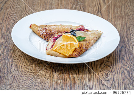 pancake with fruit and marmalade for breakfast and as dessert pancake with fruit and marmalade for breakfast and as dessert 96336774
