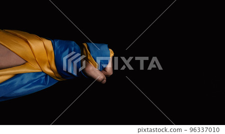 Russian flag and Ukrainian flag on a black background. Russian flag and Ukraine flag in hands showing symbol of struggle war political struggle political expressions Civil wars and territory conflict. 96337010