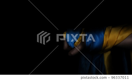 Russian flag and Ukrainian flag on a black background. Russian flag and Ukraine flag in hands showing symbol of struggle war political struggle political expressions Civil wars and territory conflict. Russian flag and Ukrainian flag on a black background. Russian flag and Ukraine flag in hands showing symbol of struggle war political struggle political expressions Civil wars and territory conflict. 96337011