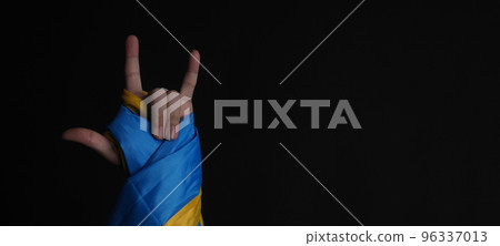 Russian flag and Ukrainian flag on a black background. Russian flag and Ukraine flag in hands showing symbol of struggle war political struggle political expressions Civil wars and territory conflict. Russian flag and Ukrainian flag on a black background. Russian flag and Ukraine flag in hands showing symbol of struggle war political struggle political expressions Civil wars and territory conflict. 96337013