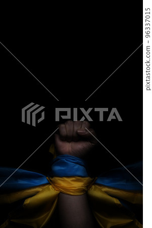 Russian flag and Ukrainian flag on a black background. Russian flag and Ukraine flag in hands showing symbol of struggle war political struggle political expressions Civil wars and territory conflict. 96337015