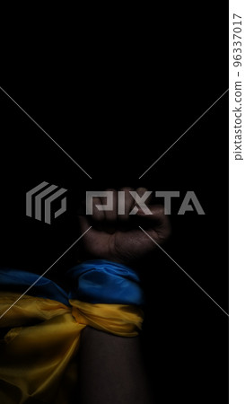 Russian flag and Ukrainian flag on a black background. Russian flag and Ukraine flag in hands showing symbol of struggle war political struggle political expressions Civil wars and territory conflict. 96337017
