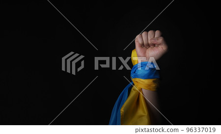 Russian flag and Ukrainian flag on a black background. Russian flag and Ukraine flag in hands showing symbol of struggle war political struggle political expressions Civil wars and territory conflict. 96337019
