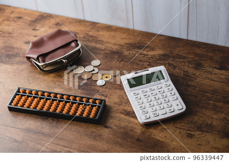 US dollar banknotes and calculator 96339447